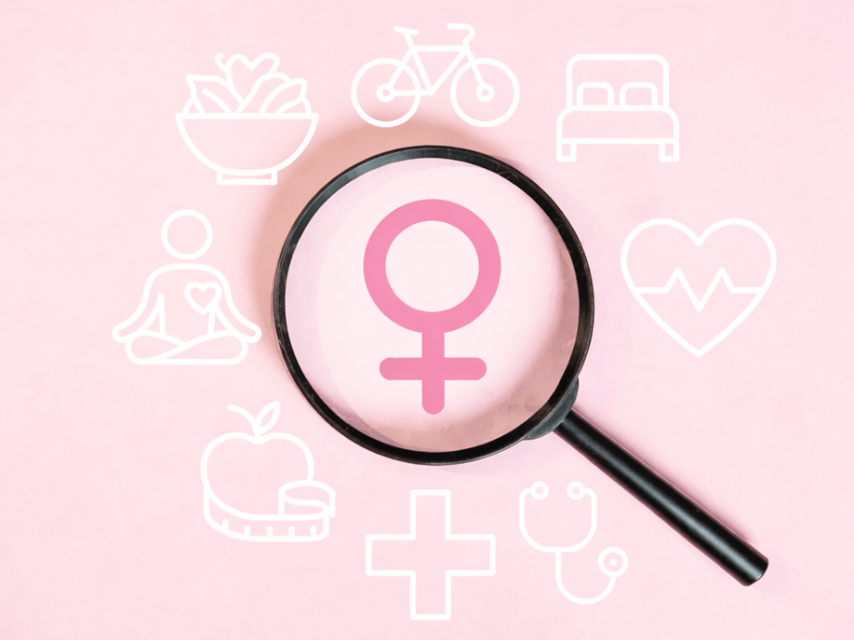 Lupa centralizada sobre símbolo feminino em fundo rosa, cercada por ícones de alimentação saudável, atividade física, sono, meditação, coração, cruz médica, maçã com fita métrica e estetoscópio, representando saúde e diagnóstico na mulher.